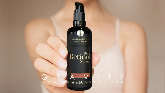 Close-up of hand holding retinol serum bottle from Kapua Naturals for skincare promotion